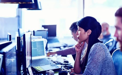 woman thinking while using a computer